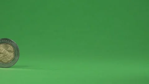 A Mexican coin standing on a chroma background, from left to right. Stock Footage 141638166