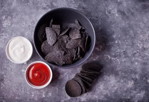 Mexican corn chips nachos with dips. Black chips nachos for brutal men. Top v Stock Photos