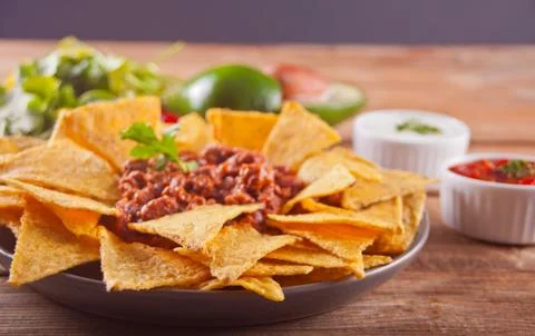 Mexican corn chips nachos with salsa dip Stock Photos