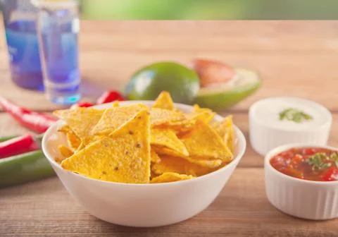 Mexican corn chips nachos with salsa dip Stock Photos