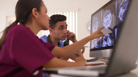 Mexican doctors analyzing brain x-rays Stock Footage 25628438