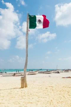 Mexican flag in beach Stock Photos