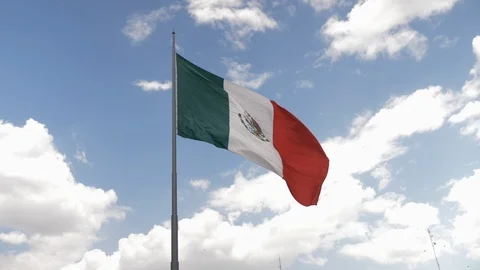 Mexican Flag Blowing in the Wind Located in the Zocalo of Mexico City Stock Footage 90397047