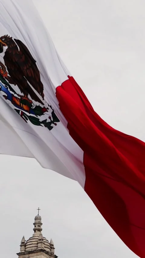 Mexican flag waving in the cathedral in merida yucatan mexico Stock Footage 304906521