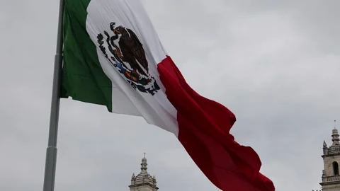 Mexican flag waving in the cathedral in merida yucatan mexico Stock Footage 304906617
