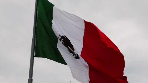 Mexican flag waving in the cathedral in merida yucatan mexico Stock Footage 304910502