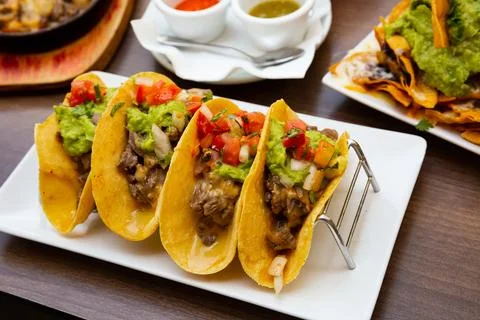 Mexican food tasty tacos with beef, guacamole sauce Stock Photos
