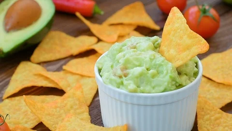 Mexican guacamole with corn chips Stock Footage 72567208