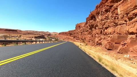Mexican Hat, Utah August 06 2023 Driving red rock desert 스톡 동영상 304493214