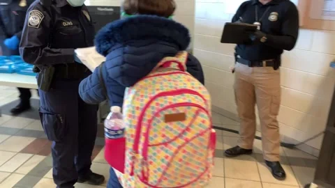 Mexican immigrant passing documents to CBP official at processing center Stock Footage 150425935
