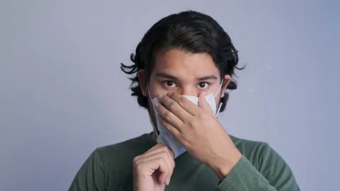 A mexican man puts on a mask Stock Footage 140234056