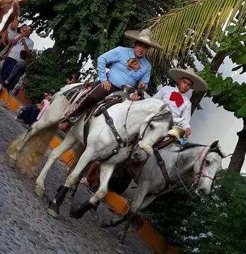 Mexican men riding Stock Photos