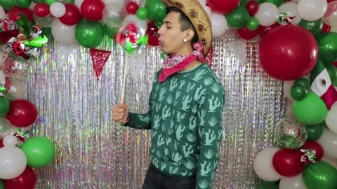 Mexican model blowing a pinwheel. Medium shot Stock Footage 194770758