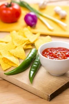 Mexican Nacho Chips and Salsa Dip arrangement on the Table Stock Photos