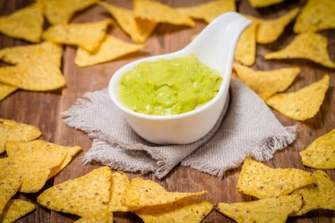 Mexican nachos with handmade guacamole sauce Stock Photos