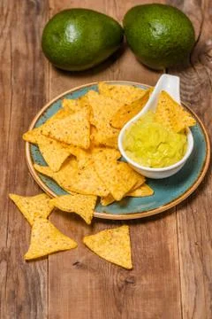 Mexican nachos with handmade guacamole sauce Stock Photos