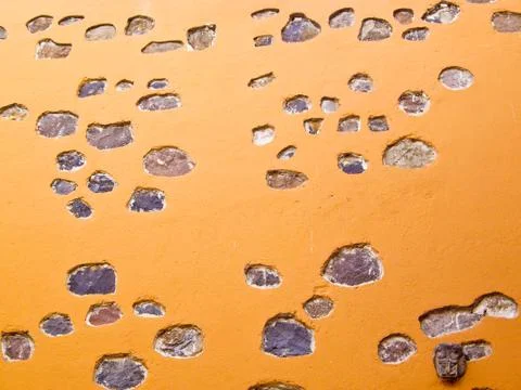 Mexican orange adobe wall Foto stock