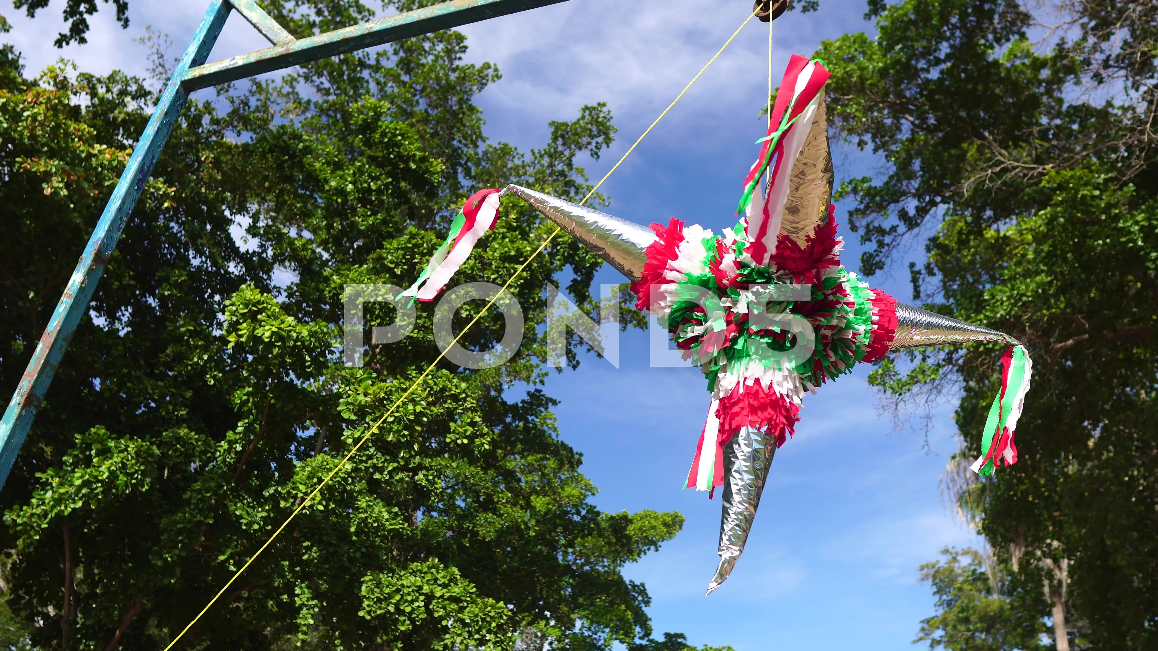 Mexican piñata hanging on a pole with a, Stock Video