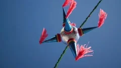 Mexican piñata hanging on a pole with a, Stock Video