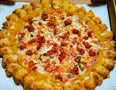 Mexican Pizza with Melted Cheese and Crispy Crust on box Fotos Stock