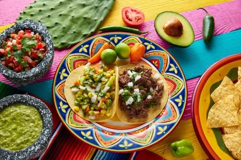 Mexican platillo tacos barbacoa and vegetarian Stock Photos