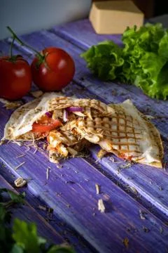 Mexican Quesadilla wrap with chicken, corn and sweet pepper and salsa. Top vi 写真素材