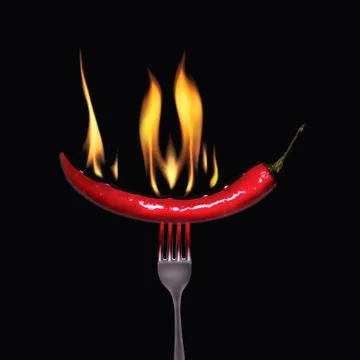 Mexican red pepper on a fork with a flame Stock Photos