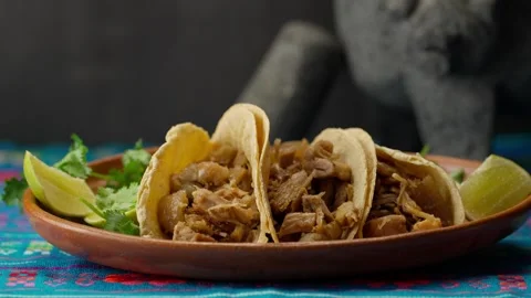Mexican Slow Cooker Pulled Pork taco on a clay plate Stock Footage 283421275