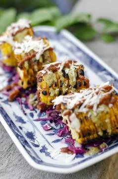 Mexican spicy bbq corn tapas snack with chilli sauce and cheese Stock Photos