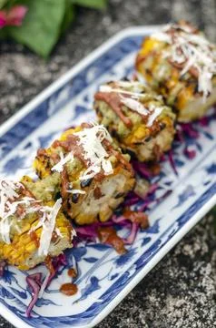 Mexican spicy bbq corn tapas snack with chilli sauce and cheese Stock Photos