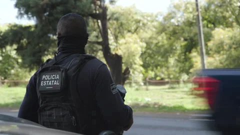 Mexican State Police officer watching ov... | Stock Video | Pond5