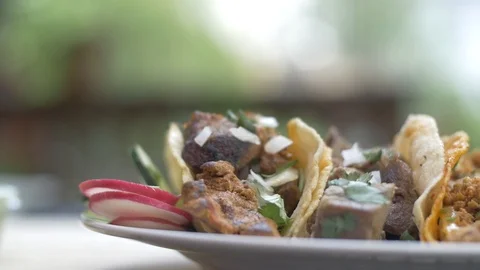 Mexican Tacos Dinner with Salsa Lime Onion and Cilantro Stock Footage 113662086
