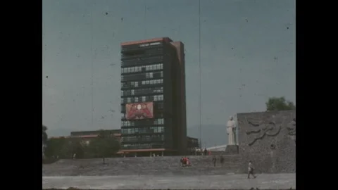 Mexico 1970s: A high-angle view of a city square features an urban building with Vídeos de archivo 340025173