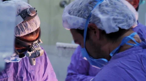 Mexico, 2014: CLOSE UP-BACK SHOULDER. Surgeons faces during surgery. Stock Footage 48208961