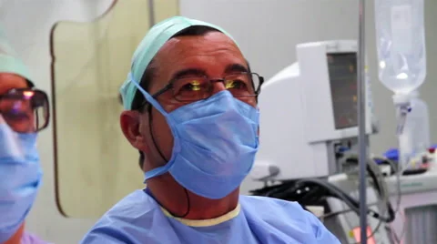 Mexico, 2014: CLOSE UP. Face surgeon during surgery. Video stock 48472433