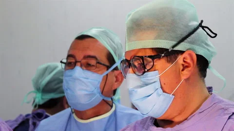 Mexico, 2014: CLOSE UP. Faces surgeons during surgery. Stock Footage 48471551