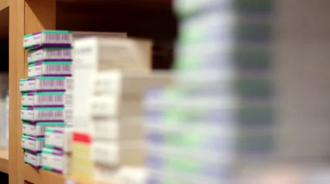Mexico, 2014: CLOSE UP-HANDHELD-FOCUS TRAVEL. Some pill boxes in a rack. Stock Footage 42841997