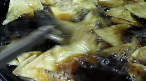 Mexico, 2014: CLOSE UP-HANDHELD SHOT. Tortilla chips being cooked. Stock Footage 42822252
