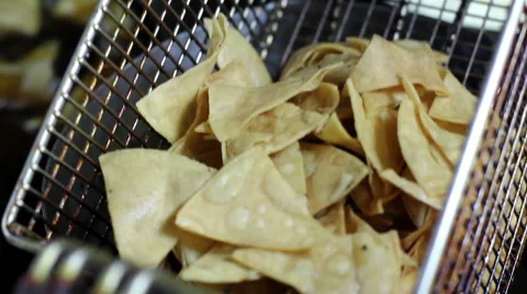 Mexico, 2014: CLOSE UP-HANDHELD SHOT. Tortilla chips being cooked. Stock Footage 42826693
