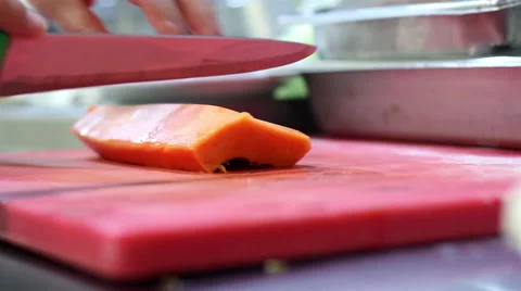 Mexico, 2014: CLOSE UP-HANDHELD SHOT. Papaya chunks being cut. Stock Footage 42827371