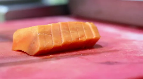 Mexico, 2014: CLOSE UP-HANDHELD SHOT. Papaya chunks being cut. Stock Footage 42827647