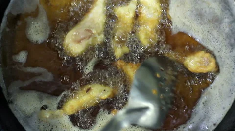 Mexico, 2014: CLOSE UP-HANDHELD SHOT. Fried chicken pieces being cooked. Stock Footage 42852403