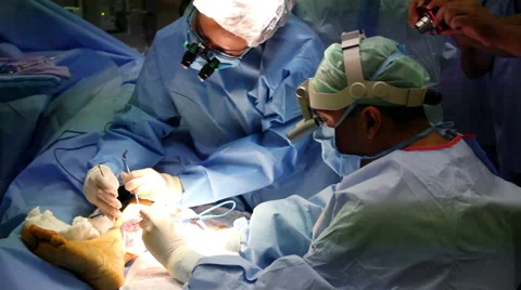 Mexico, 2014: CLOSE UP-HANDHELD SHOT. Surgery team in surgery. Stock Footage 45034441