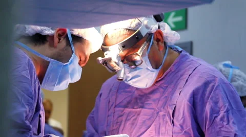 Mexico, 2014: CLOSE UP-HANDHELD SHOT. Surgeons faces during surgery. Stock Footage 48211885
