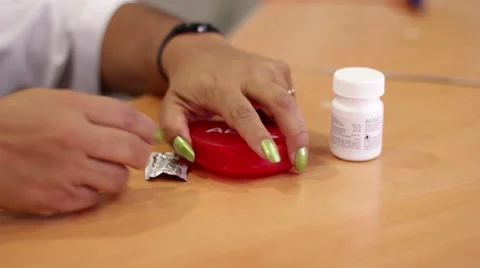 Mexico, 2014: CLOSE UP-HANDHELD. Some pills being spread in a table. Stock Footage 42843437