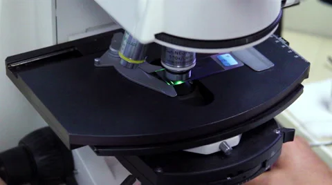 Mexico, 2014: CLOSE UP. Laboratory worker using a microscope. Stock-Footage 45001517