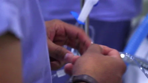 Mexico, 2014: CLOSE UP. Surgeons hands preparing material for surgery. Stock Footage 48204292
