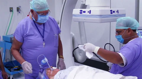 Mexico, 2014: FULL SHOT-HANDHELD SHOT. Surgeons preparing a patient for surgery Stock Footage 48207043