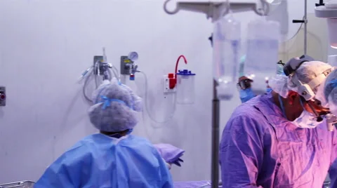Mexico, 2014: FULL SHOT. Surgeons and nurses in a Operating Room during surgery. Stock Footage 48210377