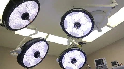 Mexico, 2014: MEDIUM SHOT-DOLLY IN. Surgical lights in a OR. Stock Footage 42830968
